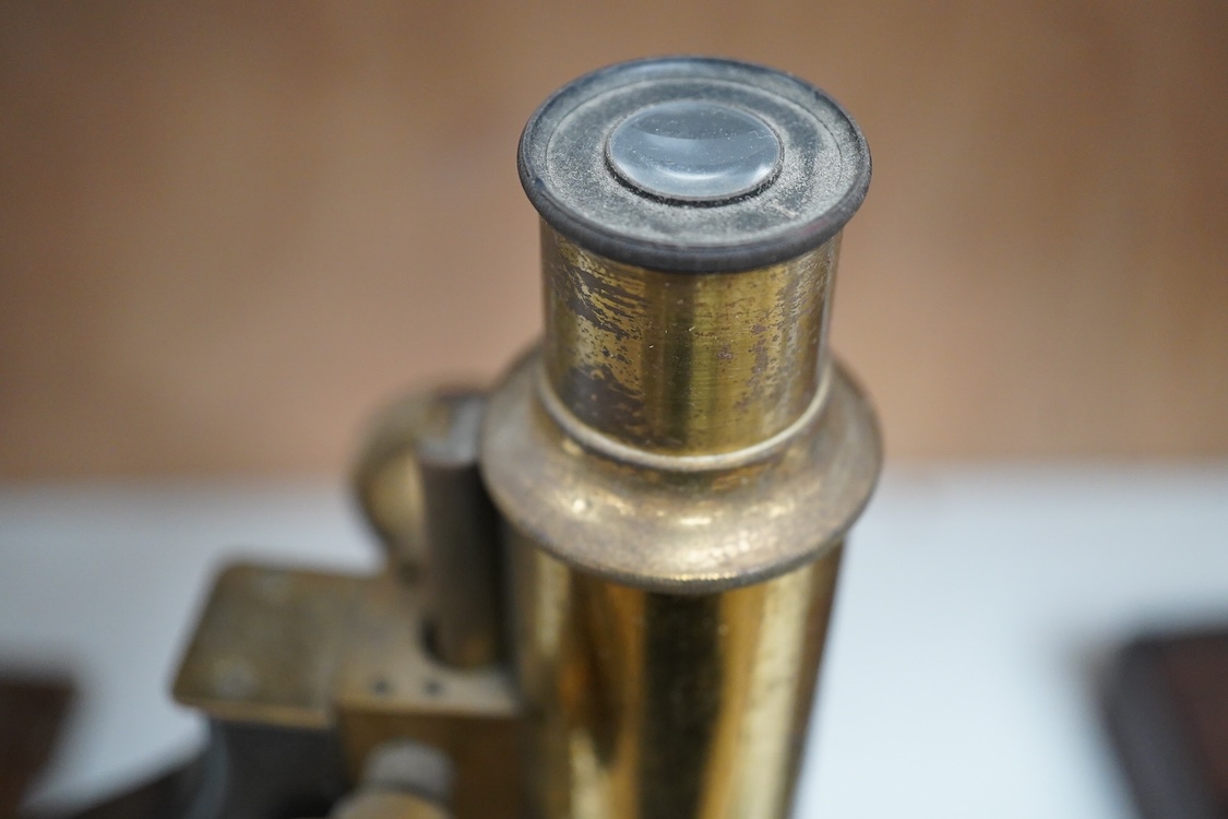 A late 19th century brass and cast iron microscope by Hearson, London, with engraved serial number; 278, approximate height 34cm